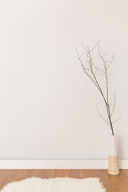 istock Lonely little twig in vase on white background 507113626