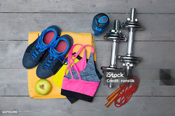 Colorful Fitness Equipment On Wooden Floor Stock Photo - Download Image Now - Active Lifestyle, Adult, Apple - Fruit