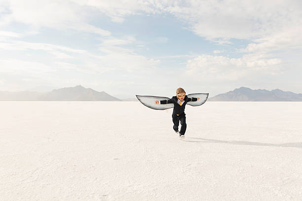 junge geschäftsmann ist flying away - taking off business creativity adventure stock-fotos und bilder