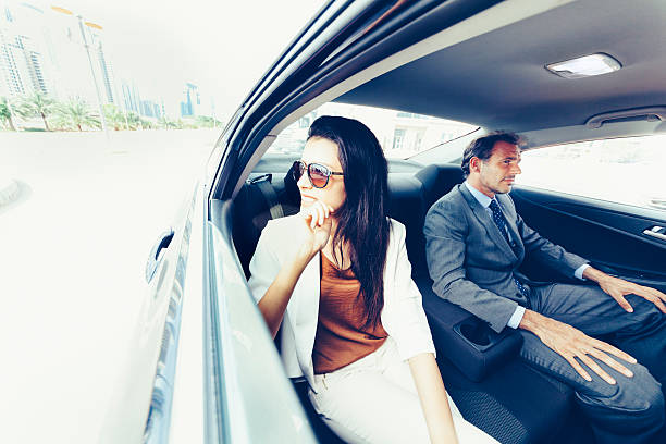 istock Business people working in backseat of car 507117716