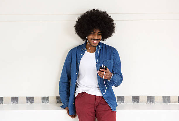 istock Modern guy listening to music with cell phone 507118088
