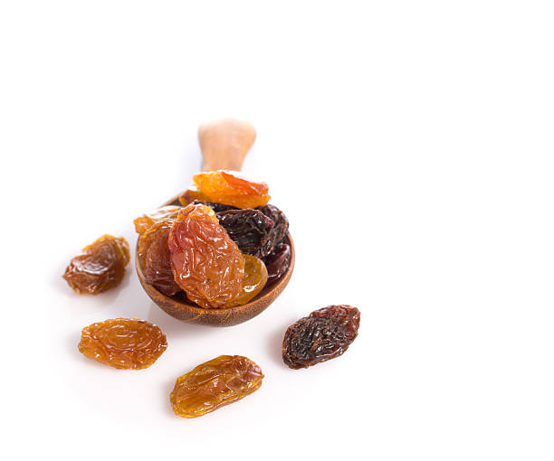 istock jumbo raisins in wooden spoon on white 507119352