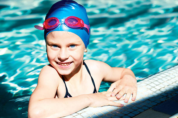istock kid laughing in a swimming pool 507120109