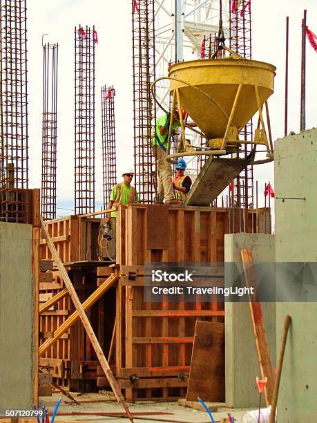 Towers Of Rebar And Cement Workers Stock Photo - Download Image Now - Adult, Building - Activity, Construction Industry