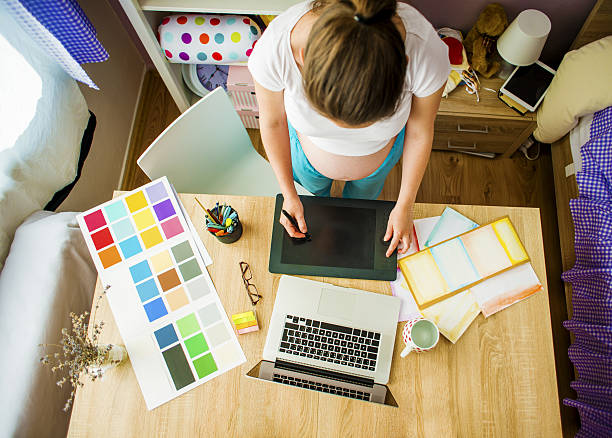istock Pregnant woman working from home 507121147