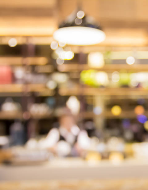 istock blur bartender working at counter in liquor shop 507121762