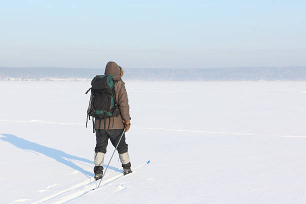istock The man the traveler with a backpack skiing on snow 507122260
