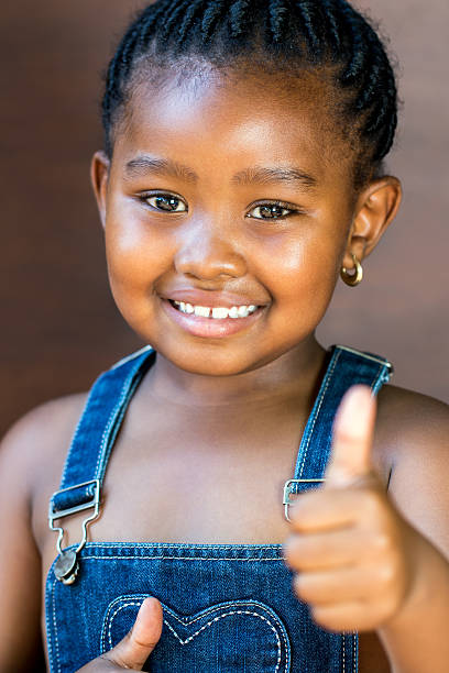 istock Cute afro american girl doing thumbs up. 507122334