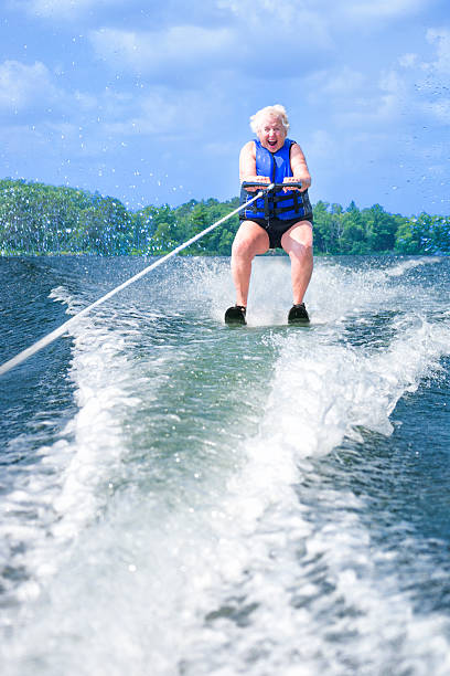 istock Happy senior woman water skiing 507122393