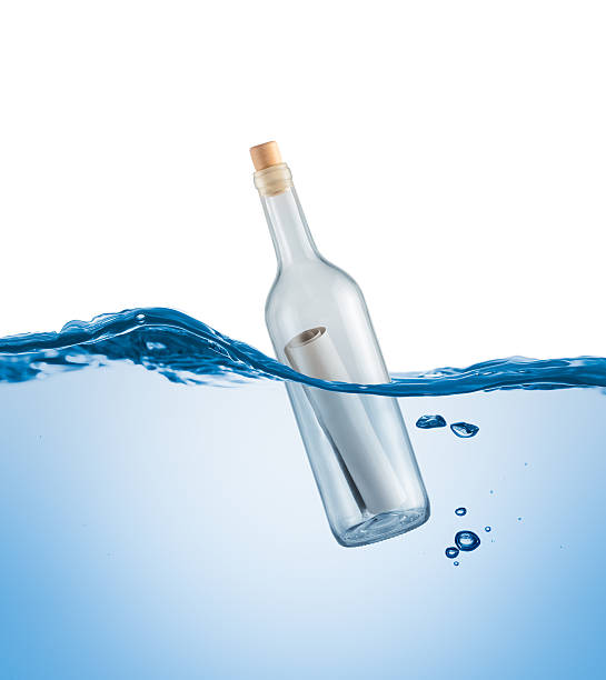 istock Bottle with a letter in the water 507122499