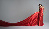 Fashion model in a red long dress
