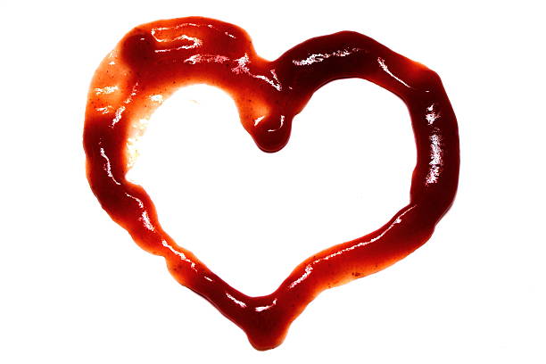 istock Red heart of ketchup isolated on white background 507123189