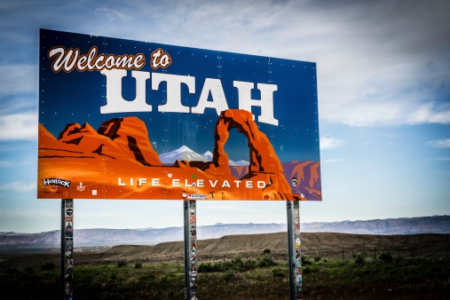 Loma, Utah - May 22, 2014: A Welcome to Utah sign at the border of Colorado and Utah.