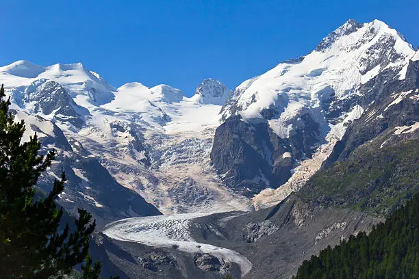 View to Piz Bernina, Switzerland and to the beginning of the Morteratsch Glacier. The Piz Bernina is 4,049 m (13,284 ft) high and it is the highest mountain in the Eastern Alps.