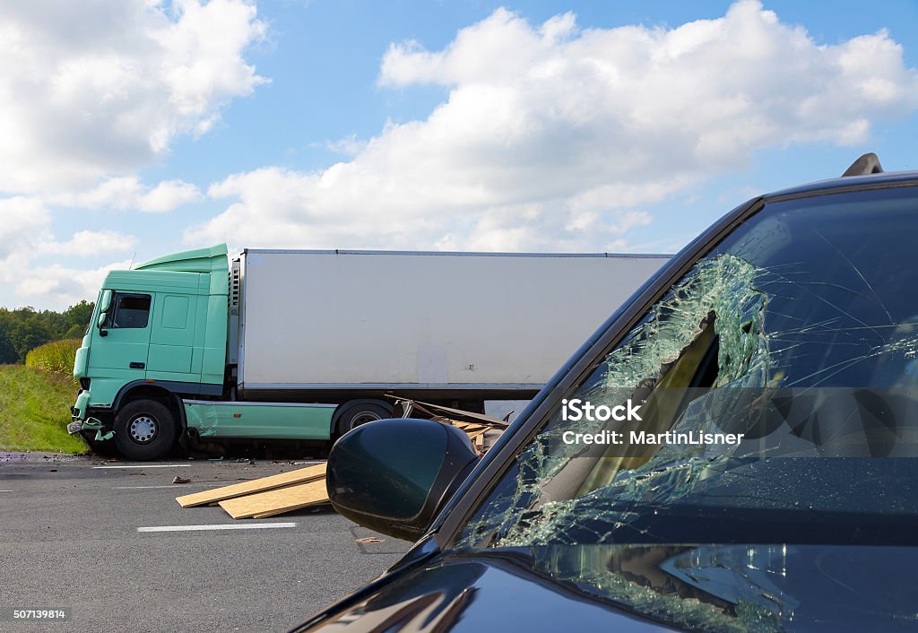 View of truck in an accident with car View of truck in an accident with car, cloudy sky Crash Stock Photo