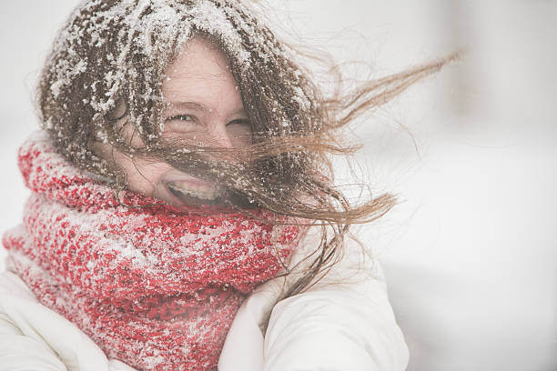 Teenager girl under snowfall at the street Teenager girl in the blue jacket and cape under snowfall at the street in Queens Village, New York City, NY, during the snowstorm Jonas frost face stock pictures, royalty-free photos & images