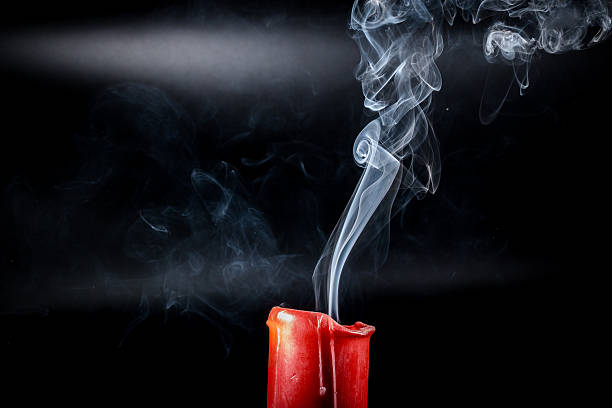 istock gray smoke flying upside from the extinct red candles 507140510