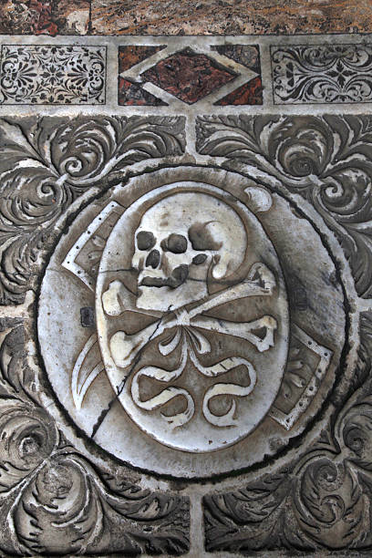 istock Skull on the medieval marble tomb, Pisa, Italy 507141910