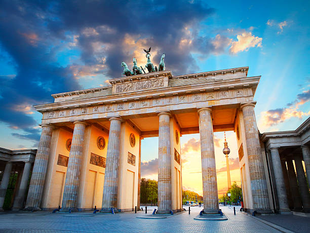 Brandenburg Gate and the TV tower at Pariser Platz in Berlin in sunset light