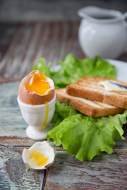 istock Breakfast with egg and toast on a wooden background 507145238