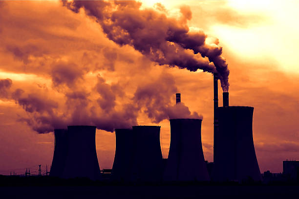istock View of smoking coal power plant at sunset 507145416
