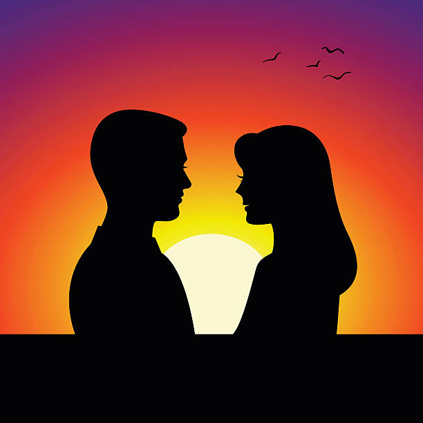 istock Black couple silhouettes in front of sunset background 507146216