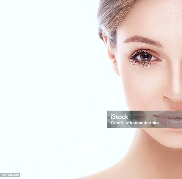 Beautiful Woman Halfface Close Up Studio Isolated On White Background Stock Photo - Download Image Now