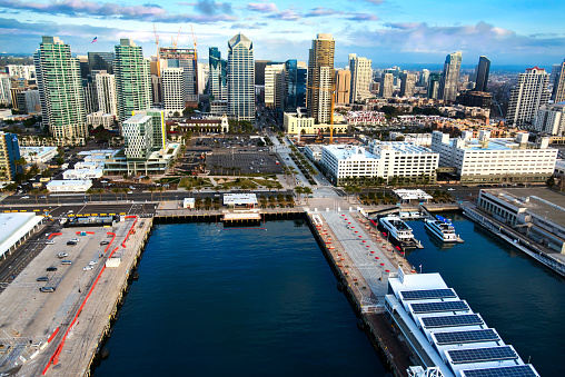 The commercial docks and the skyline of beautiful downtown San Diego, California.  This image was shot from a helicopter chartered for the purpose of shooting the San Diego coastline.  This unique perspective was just just over the bay at about 400 feet elevation.  