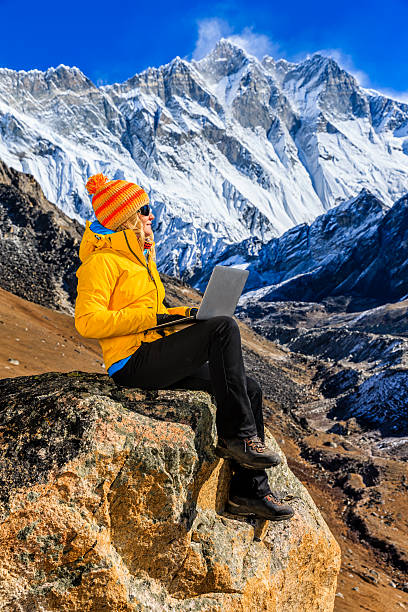istock Young woman using laptop in Himalayas, Nepal 507150186