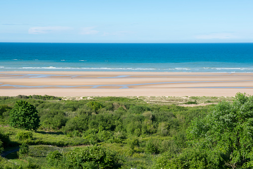 A view of Omaha Beach and the Atlantic Ocean from the Normandy American Cemetery and Memorial in Colleville-sur-Mer, France. Omaha Beach was one of the D-Day landing beaches on June 6, 1944