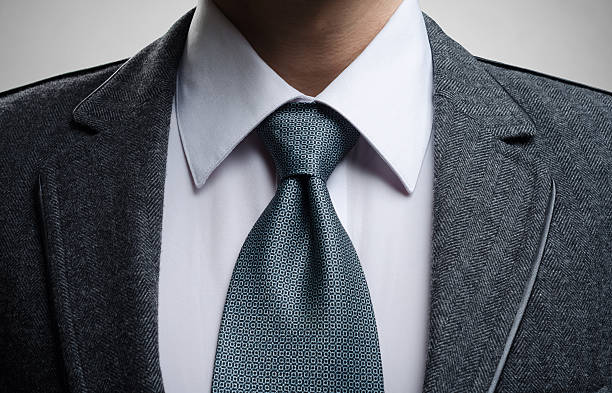 istock gentleman in a gray suit and tie 507155130