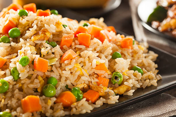 Healthy Homemade Fried Rice Healthy Homemade Fried Rice with Carrots and Peas fried rice stock pictures, royalty-free photos & images