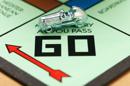 Richmond, Virginia, USA - August 15, 2014: The race car piece on GO starting a Monopoly game.