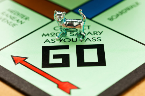 Richmond, Virginia, USA - August 15, 2014: The cat piece on GO starting a Monopoly game.