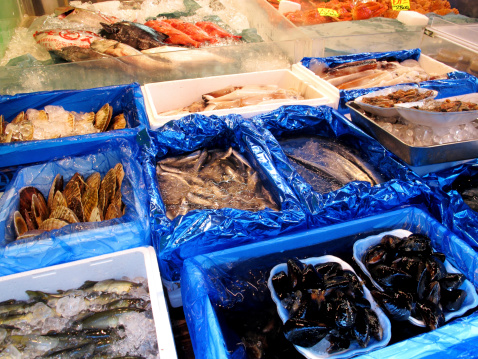 Tokyo, Japan - August 20, 2013: Marine product in seafood retail shop at Tsukiji market, located in central Tokyo.