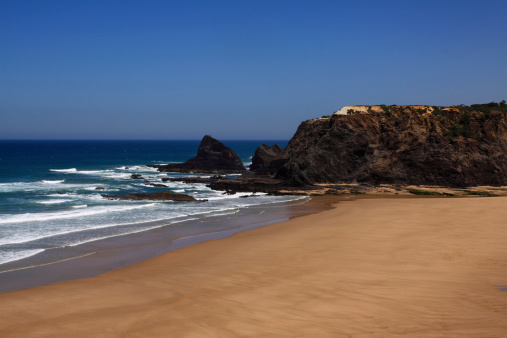 Portugal, Algarve Region,Odeceixe, South-West Alentejo and Vicentine Coast Natural Park cliff top view of Odeceixe beach and estuary.