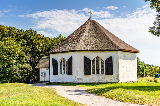 Chapel in Vitt with traditional thatching roof house
