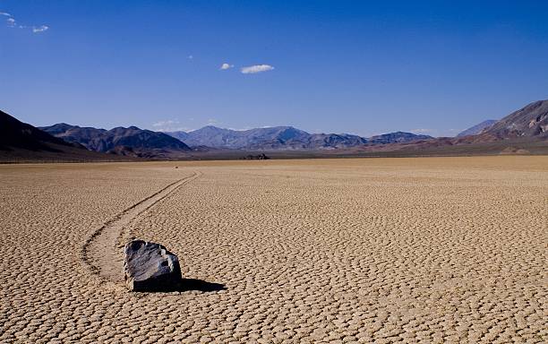 Racetrack Playa, Death Valley NP Mysterious Racetrack where stones are moving around by unknown forces racetrack playa stock pictures, royalty-free photos & images