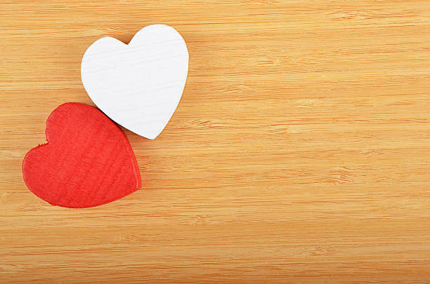 istock Heart on wooden background 507157388