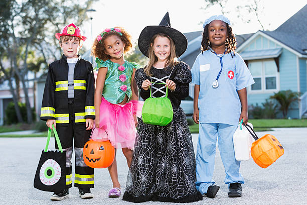 istock Children in halloween costumes going trick or treating 507157489