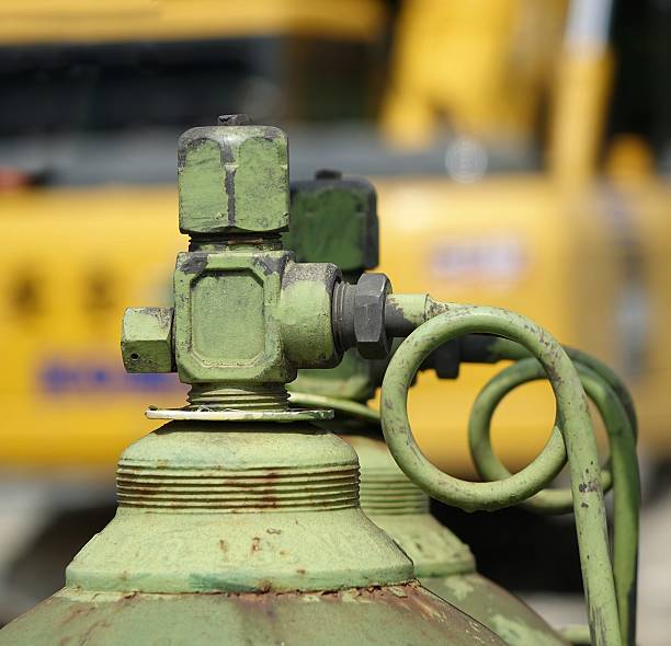 Large Oxygen Bottle at Construction Site Acetylen and oxygen bottles used for welding at a construction site oxyacetylene stock pictures, royalty-free photos & images