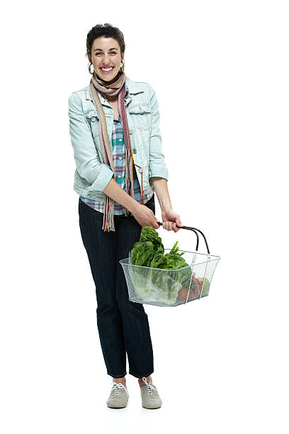 istock Cheerful woman holding vegetable basket 507160981