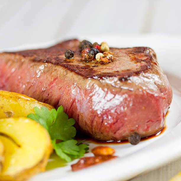 istock steak with potato wedges 507161889