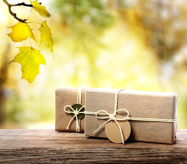 Handcrafted gift boxes with an autumn foliage background