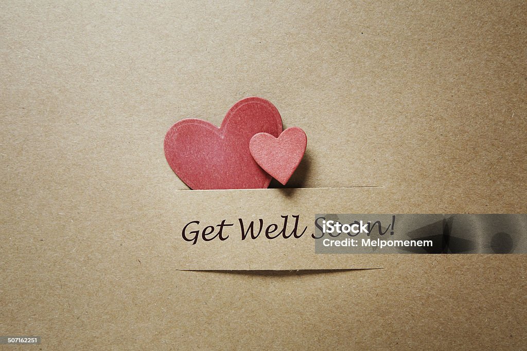Get Well Soon message with red hearts Get Well Soon message with red paper hearts Get Well Card Stock Photo