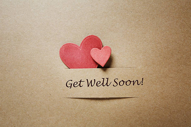 Get Well Soon message with red hearts Get Well Soon message with red paper hearts get well soon stock pictures, royalty-free photos & images