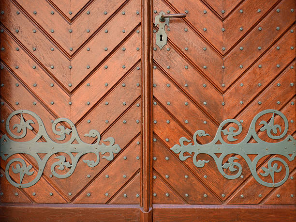 istock Metal ornaments and rivets on an old castle door 507162377