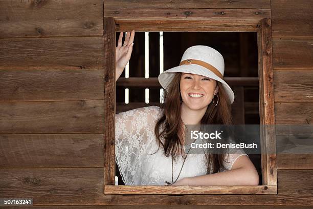 Happy Young Woman In Window Stock Photo - Download Image Now - Adult, Adults Only, Barn