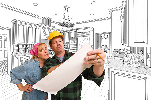 istock Contractor Discussing Plans with Woman, Kitchen Drawing Behind 507168496
