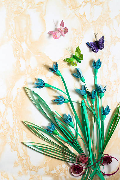 istock Festive background with snowdrops in the technique of quilling 507169314